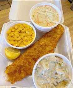 Fried fish with sides of coleslaw and mac & cheese from Yankee Kitchen